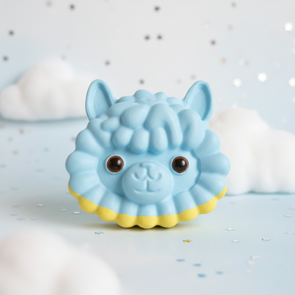 Painted sky blue alpaca head with lemon collar on pale blue clouds and silver stars background
