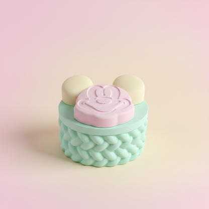 Painted pastel pink cartoon mouse trinket box with mint base on soft pink and yellow gradient background