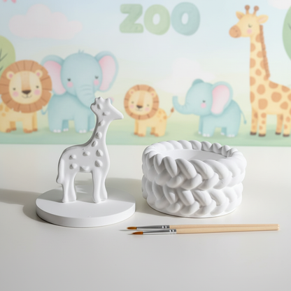 White plaster giraffe trinket box lid off with paintbrushes on pastel zoo background