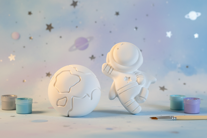 Paint Your Own Plaster Spaceman and Moon with soft space background and paint pots