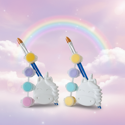 Two unicorn plaster kits with magical rainbow background
