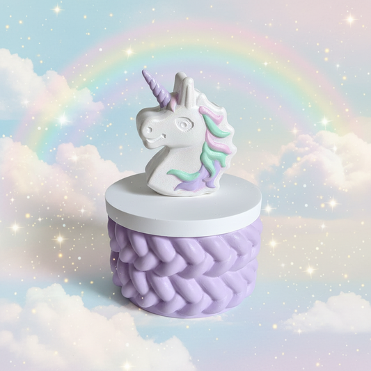 Painted unicorn head trinket box with lilac horn and rainbow mane on dreamy pastel rainbow sky background