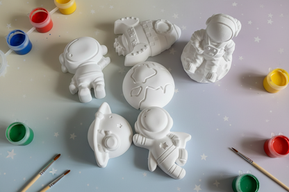 Paint Your Own Plaster Space Bumper Pack with soft starry cream blue lilac background and paint pots