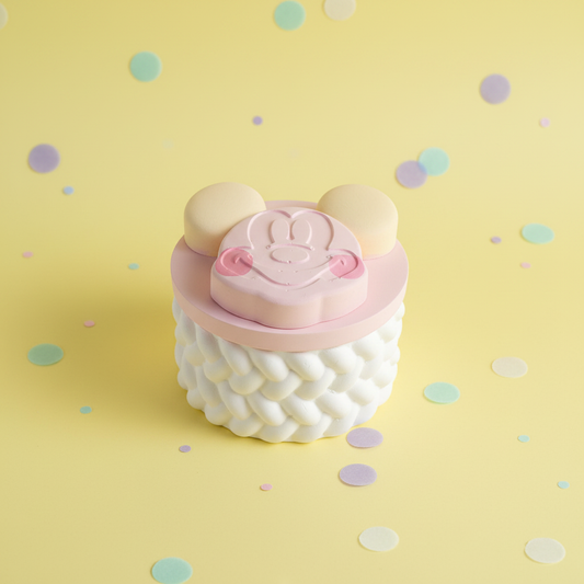 Painted pastel pink cartoon mouse head with white rope-twist base on cheerful yellow confetti background