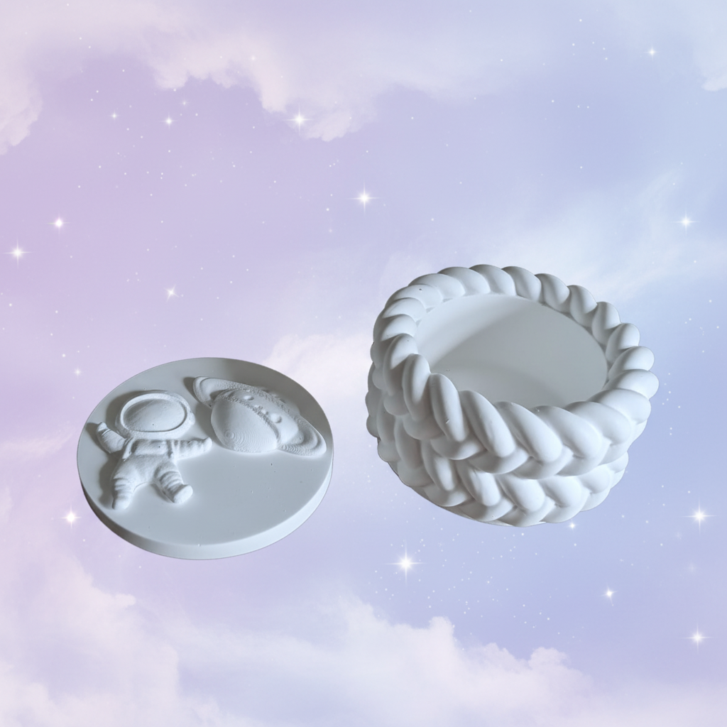 White plaster space trinket box lid off showing inside storage on soft lilac and periwinkle space background